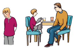 Ein Kind spricht mit seinem Vater, sie sitzen an einem Tisch